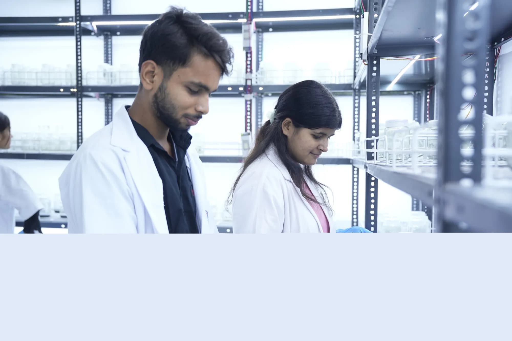 Trainees holding completion certificates inside the Cell Grow Biotech India facility